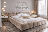 Modern bedroom with a large bed and Stratus Interiors branding on the wall.