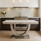 Modern kitchen with a marble island and pendant lights.